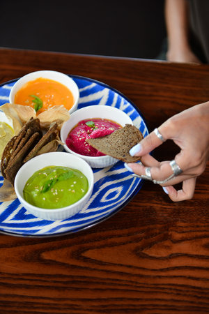 Classic eastern snacks. Hummus set in small bowl