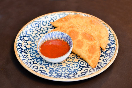 Russian cuisine is tasty chebureki fried dough with meat.