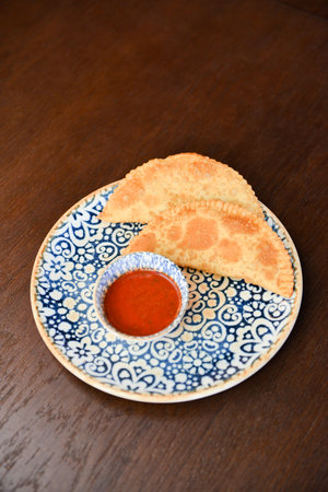 Russian cuisine is tasty chebureki fried dough with meat.の写真素材