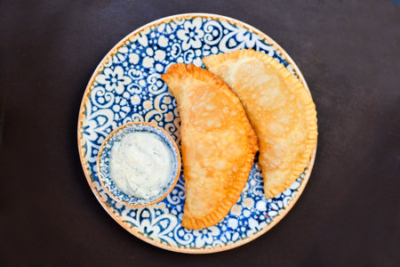 Russian cuisine is tasty chebureki fried dough with meat.の写真素材