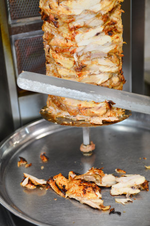 chicken being cooked on a barbecue grillの写真素材