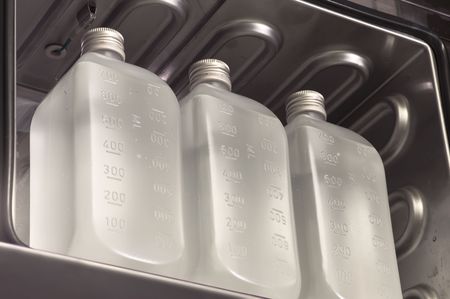 Infusion bottles in a stoveの写真素材