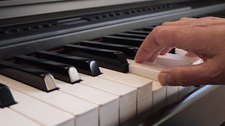 Playing on the pianoの写真素材