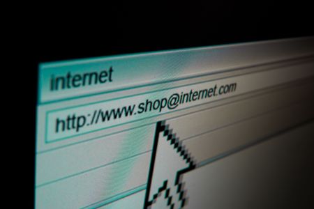 A computer screen, giant mouse pointer and a web browser.の写真素材