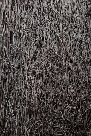 A background tefture iage of grey fishing net.の写真素材