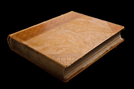 An old book isolated. The book has worn leather covers.の写真素材