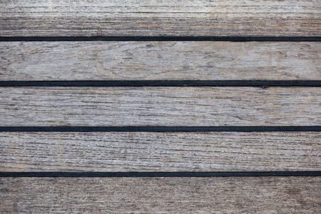 A background texture image of teak decking with black sealant.の写真素材