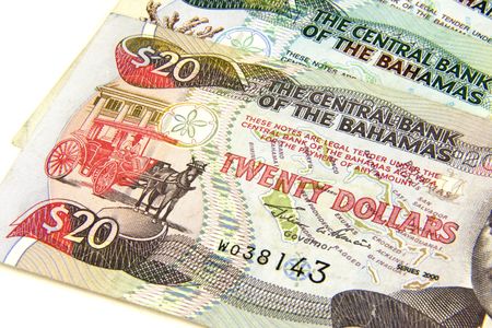 Foreign dollar bills from the Bahamas, twenty dollar on top.の写真素材
