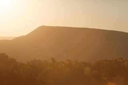Mountain silhouette with the rays of the sunset Crimea.の写真素材