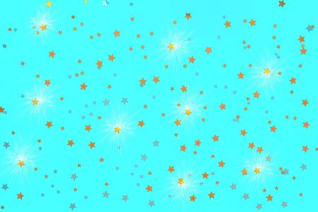 Photo of gold stars confetti sprinkles on blue backdrop with shine effect. Festive holiday background for your projects. Celebration concept. Christmas pattern. Top view.の写真素材