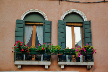 View of house windows in the old town Venice Italyの写真素材