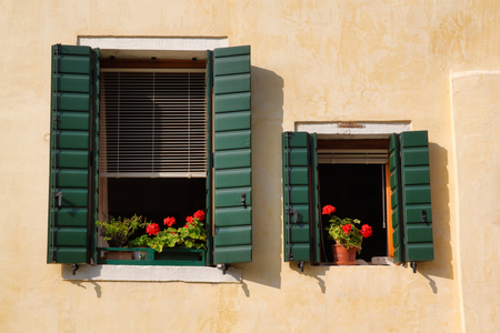 View of house windows with shutter in the old town Venice Italyの写真素材