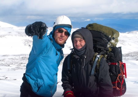 two hikers in the snow mountainsの写真素材