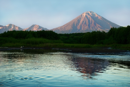 landscape with volcano Koryaksky and his reflection on the river Avacha located on Kamchatkaの写真素材