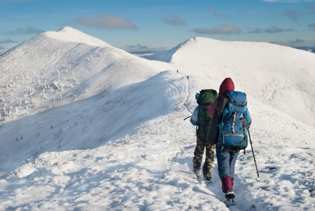 hikers in the snowy mountainsの写真素材