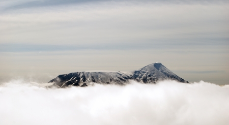 peaks of mountains above the clouds, Russia, Kamchatkaの写真素材