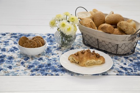 Continental breakfast with fresh croissants, bread, biscuits on table, selective focuse.の写真素材