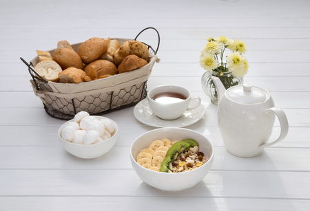 Breakfast with oatmeal porridge, coffee cup and fruits. Oatmeal with kiwi and banana. Healthy breakfast concept. Top viewの写真素材