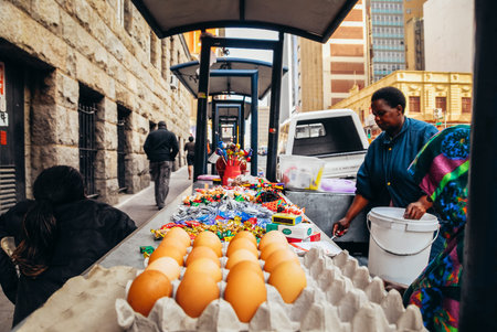 Johannesburg , Gauteng South Africa - April 27 2022 : street sellers table of goods along the...