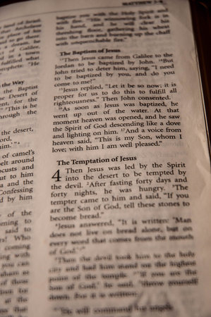 A closeup shot of the inside of an old book with the word in it