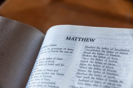 The Holy Bible on a wooden table close-up. Selective focus.
