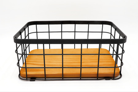 Blank metal basket isolated on whiteの写真素材