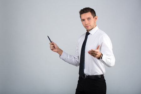 Portrait of a businessman on a gray backgroundの写真素材