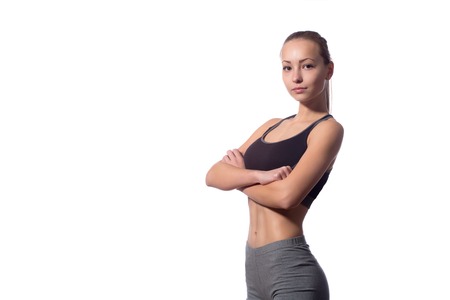 young fitness model in the studio on a white background. isolateの写真素材