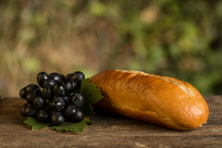 Assortment of fresh baked goods wooden background. baguette and cookies in the open spaceの写真素材