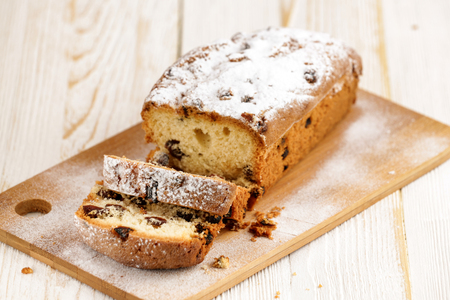 Delicious homemade cake with raisins on a light wooden background. close-up. rustic. copy space.の写真素材