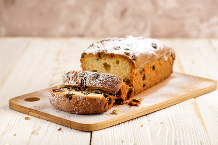 Delicious homemade cake with raisins on a light wooden background. close-up. rustic. copy space.の写真素材