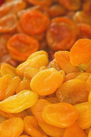 Dry apricots arranged at the backgroundの写真素材