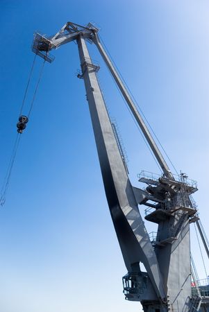 big harbor crane in the background of blue skyの写真素材