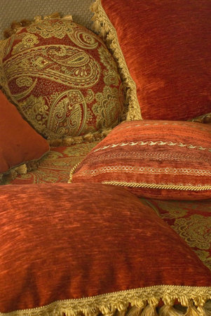 soft pillows with patterns lying on the couchの写真素材