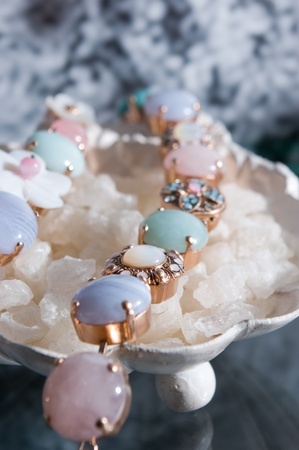 colorful beads necklace lying on the crystalsの写真素材