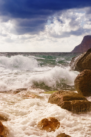 sea waves   rolling on stonesの写真素材