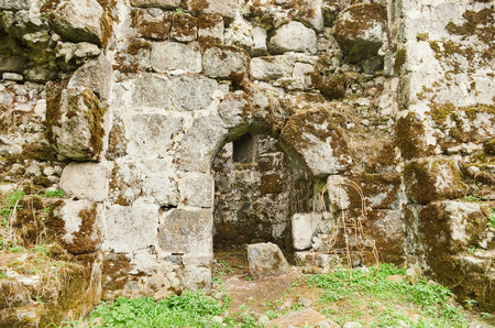 Fragment of the old fortress wall with the entrance to the towerのeditorial素材