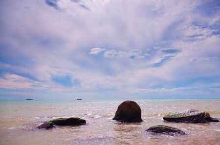 sea waves   rolling on stonesの写真素材