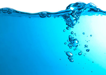 Pouring made a splash of blue waves under the water and Bubbles flowing up on water surface in nature. with copy spaceの写真素材
