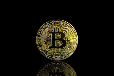 Bitcoin BTC Cryptocurrency Gold Coin coin of the future Concept of virtual currency, stock market, isolated on black background.のeditorial素材