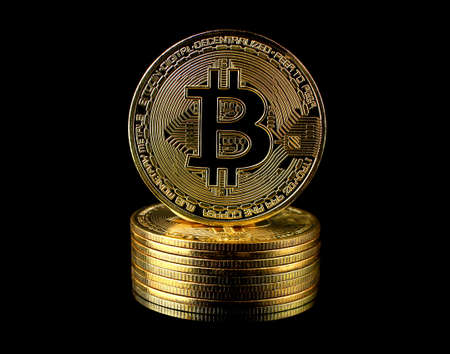 Bitcoin BTC Cryptocurrency Gold Coin coin of the future Concept of virtual currency, stock market, isolated on black background.のeditorial素材