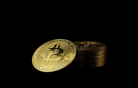Bitcoin BTC Cryptocurrency Gold Coin coin of the future Concept of virtual currency, stock market, isolated on black background.のeditorial素材