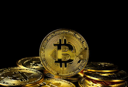 Bitcoin BTC Cryptocurrency Gold Coin coin of the future Concept of virtual currency, stock market, isolated on black background.のeditorial素材