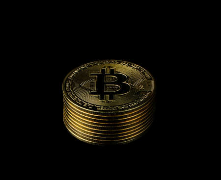 Bitcoin BTC Cryptocurrency Gold Coin coin of the future Concept of virtual currency, stock market, isolated on black background. Lamphun, Thailand - 08. 02. 2021のeditorial素材
