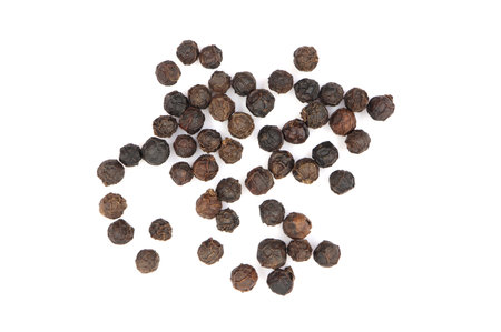 top view, a pile of black pepper seeds as a spice. isolated on a white background