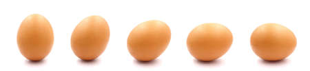 Close-up of a set of single brown chicken eggs. isolated on a white background.の写真素材