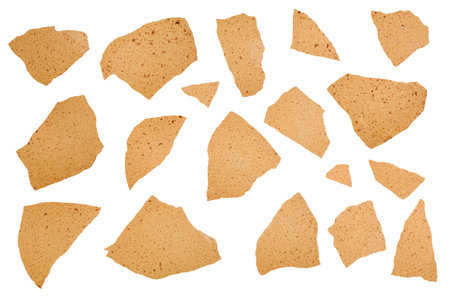 Top view of brown cracked eggshell, brittle and thin, lying flat, isolated on white background.