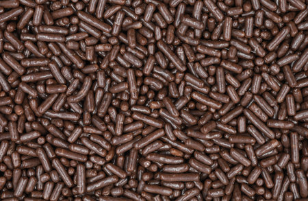 top view close-up texture. chocolate sprinkles are a small, sweet food, for donuts, and cakes for...