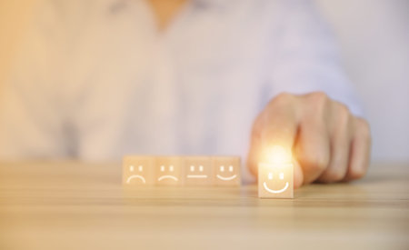 positive customer reviews Tap the wooden block, happiness icon and five-star smiley face. Satisfaction survey concept, opinions, customer service The best response from the user experience of the prodの写真素材