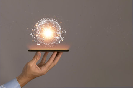 Businessman showing a globe in his hand Digital technology shows success. online application concept Worldwide links. Internet Big Data Network Connection of business and marketing Finance and Bankingの写真素材